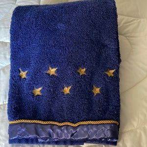 Navy bath towel with gold braid and gold embroidered stars